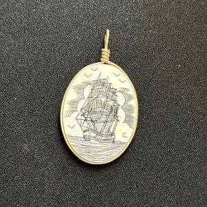 Vintage scrimshaw etched ivory necklace charm